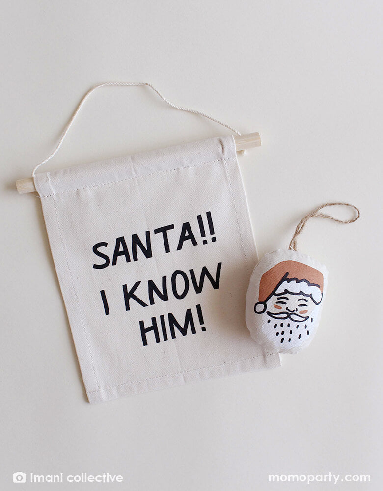 Imani Collective - Santa plush Ornament and "Santa!! I know him!" Christmas hang sign. These modern Plush ornament and hang sign made with Natural canvas and printing was sewn and screen printed by hand on natural canvas by local artisans in Kenya. This modern holiday decoration is perfect for this Holiday season, christmas tree decoration, holiday small gift. Sold by Momopartys store provided modern party supplies, boutique party supplies, chic holiday party supplies and high end party supplies
