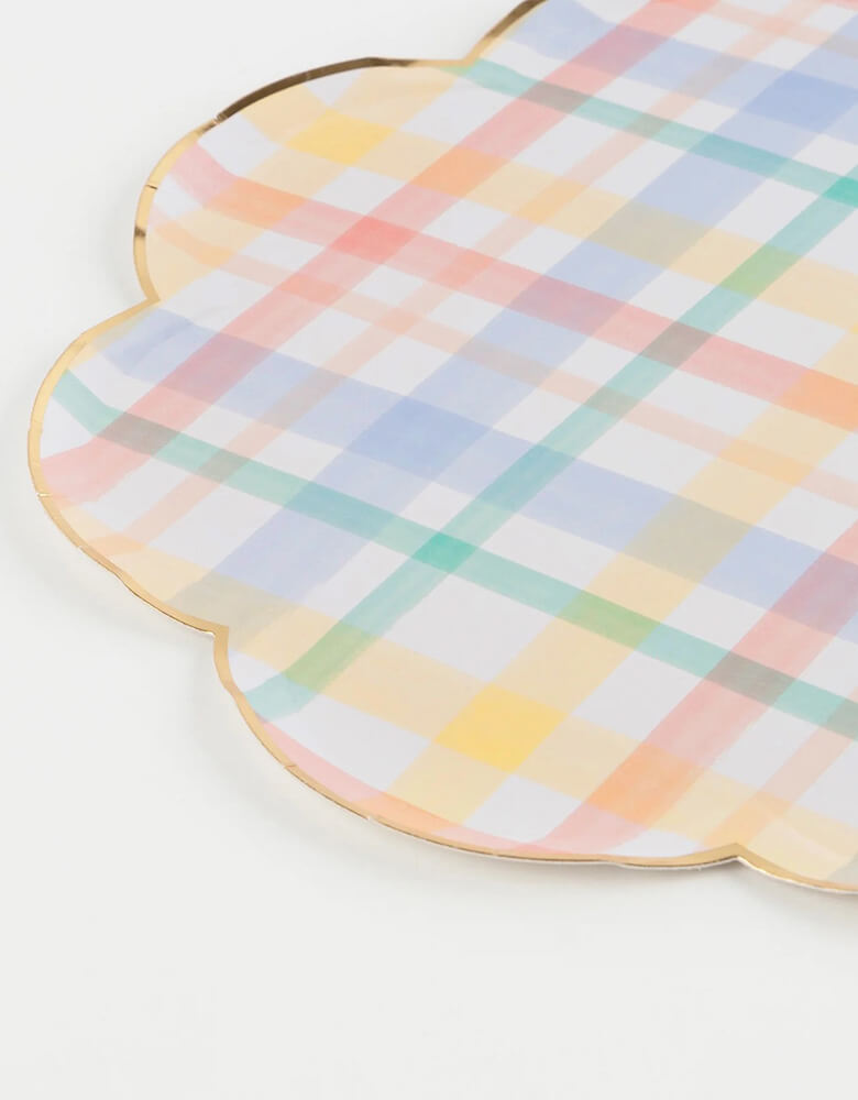A close-up shot of Momopartys's 10.25" x 10.25" plaid patterned dinner plates by Meri Meri. Add a touch of nostalgia to your party plates with these vintage-inspired plaid designs. They are perfect for any celebration where you want soft muted shades - ideal for baby showers and birthday parties. We love using them for a spring inspired party or an Easter celebration.
